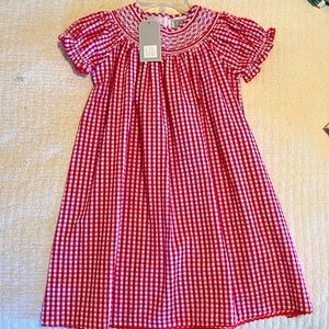 NWT beautiful smocked red dress. Perfect for Christmas.